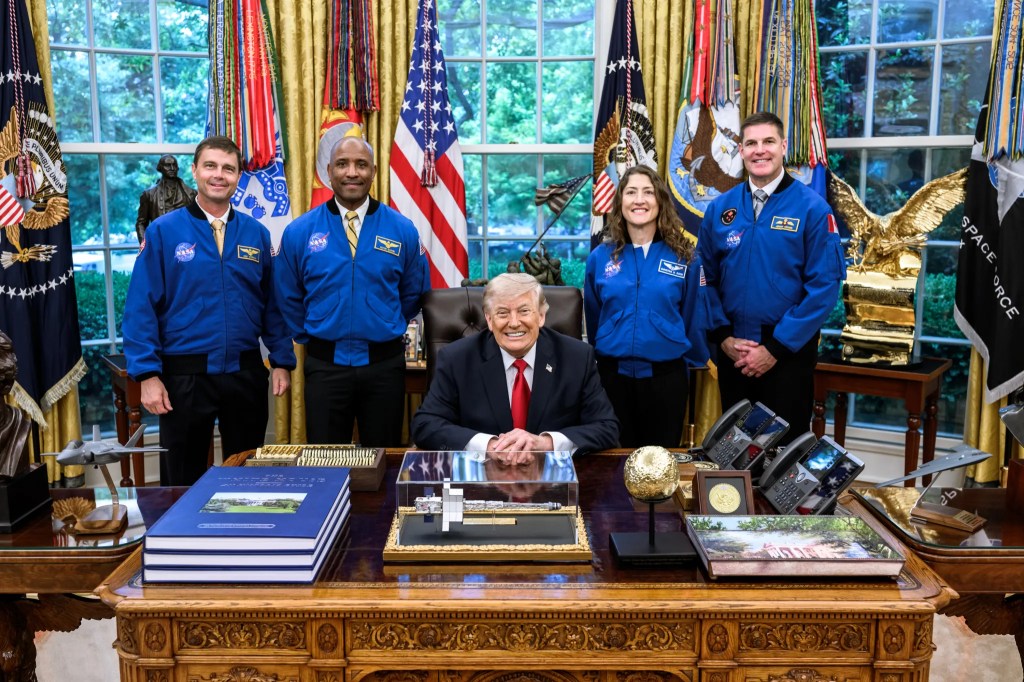 From left, Artemis II crew NASA astronauts Reid Wiseman, Victor Glover, Christina Koch, and CSA (Canadian Space Agency) astronaut Jeremy Hansen are photographed on April 29, 2026, in the White House Oval Office with President Donald J. Trump.